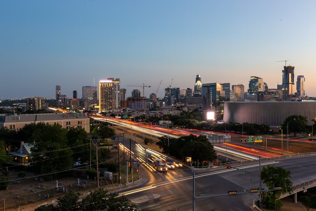 a city skyline at night — Photo by Ross Bonander on Unsplash