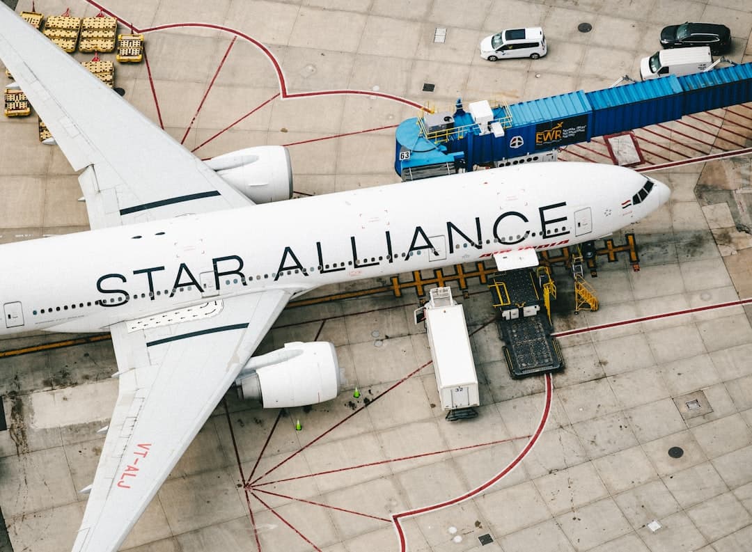 white and blue airplane on airport during daytime — Photo by Chris Leipelt on Unsplash