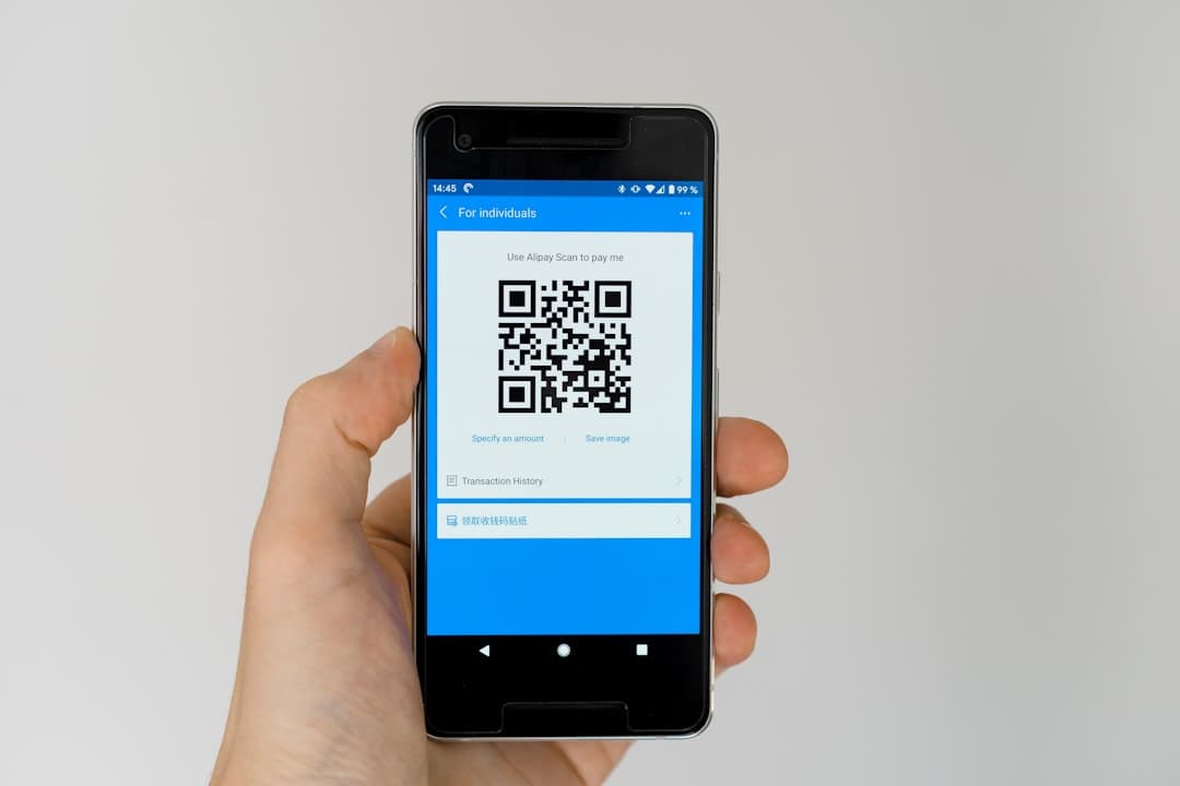 black android smartphone displaying qr code — Photo by Markus Winkler on Unsplash