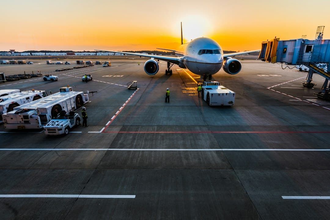 gray airplane on parking — Photo by Rocker Sta on Unsplash