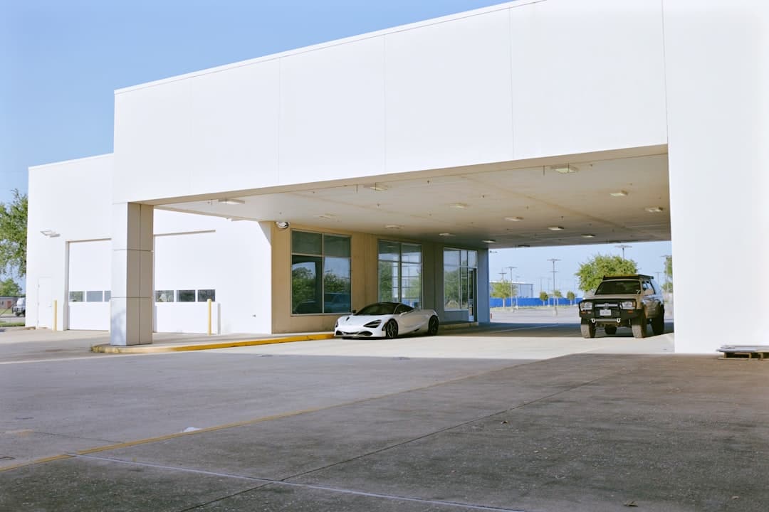 a building with a parking lot — Photo by Jeff James on Unsplash