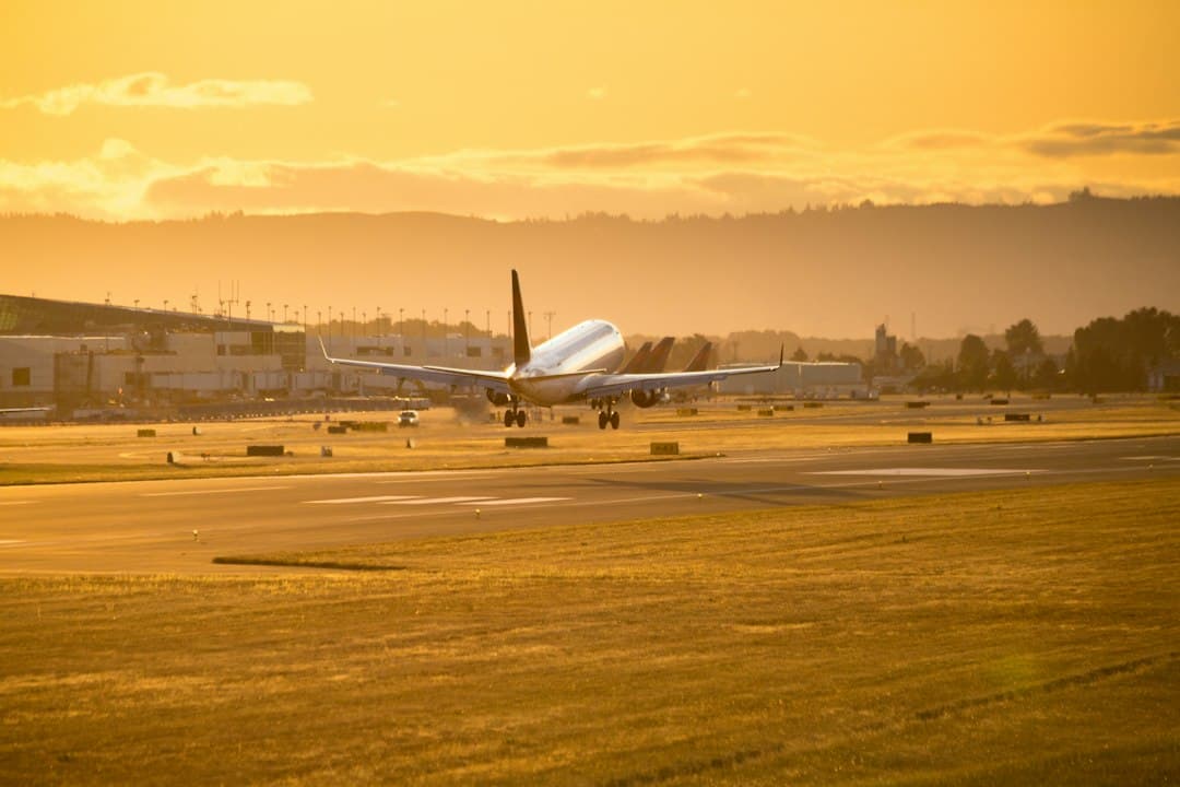 white airplane on brown field during daytime — Photo by Avel Chuklanov on Unsplash