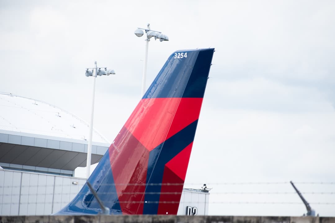 A large jetliner sitting on top of an airport tarmac — Photo by Jacob Narkiewicz on Unsplash