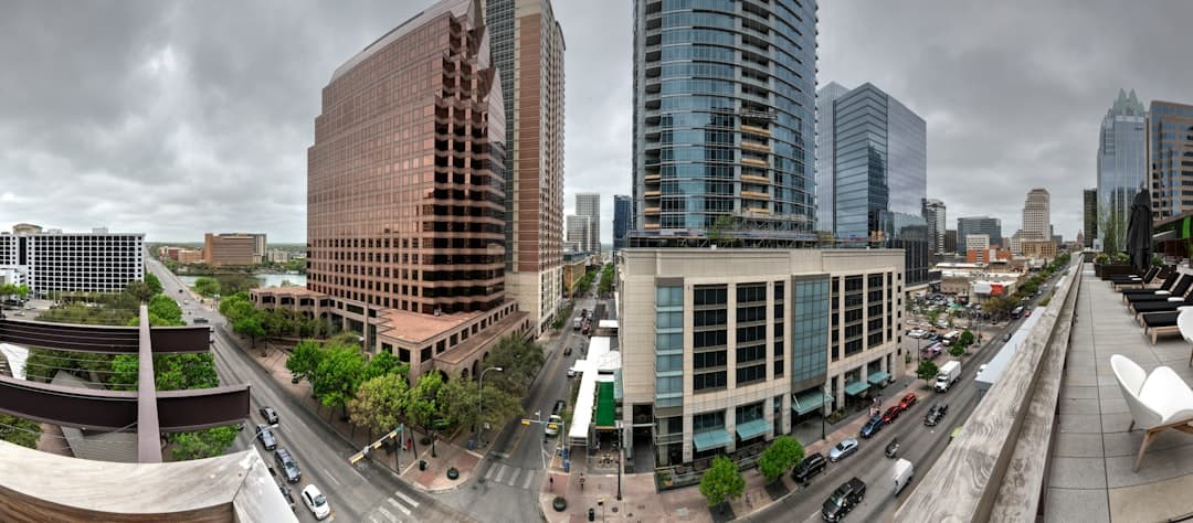 cars parked on the side of the road near high rise buildings during daytime — Photo by Jacques Bopp on Unsplash