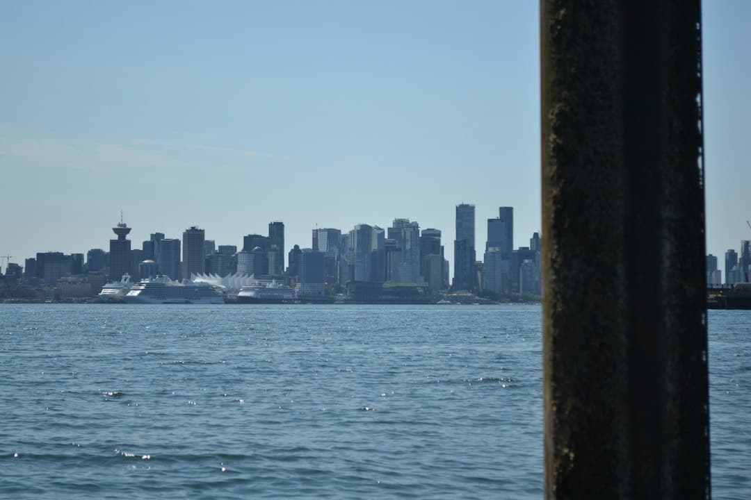 The Vancouver skyline across the water with cruise ships docked at the harbor — Photo by Dylan Lees on Unsplash