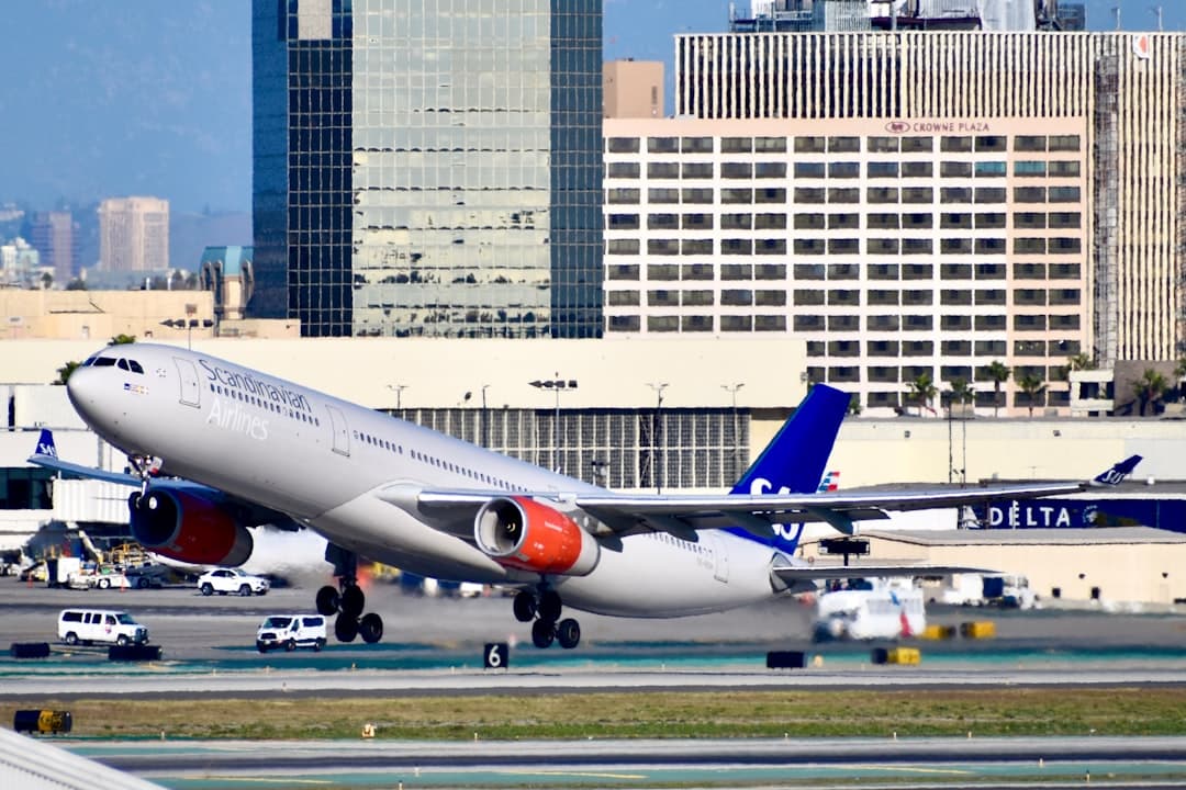 white and blue passenger plane on airport during daytime — Photo by Beckett P on Unsplash