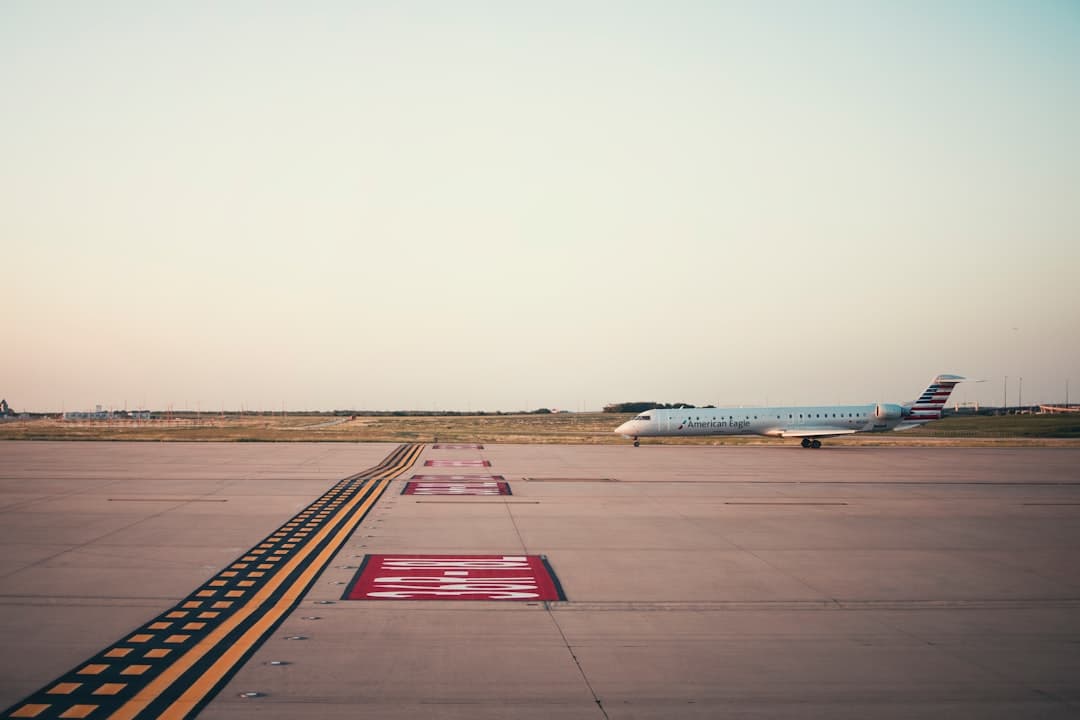 white and blue airplane on brown field during daytime — Photo by Gabriel Tovar on Unsplash