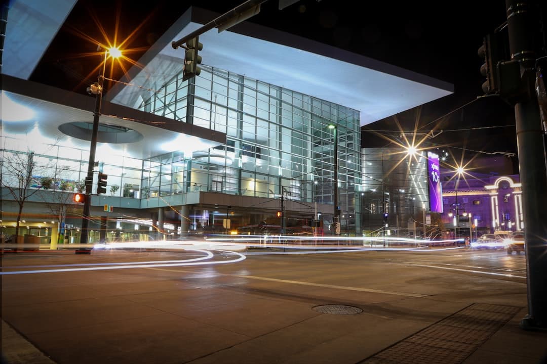 a city street at night with a building in the background — Photo by Frankie Lopez on Unsplash