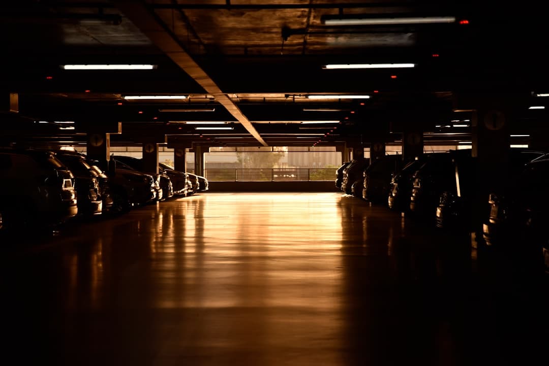 a parking garage filled with lots of parked cars — Photo by Mahboba Rezayi on Unsplash