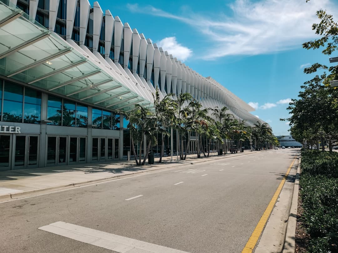 An empty street in front of a large building — Photo by Zoshua Colah on Unsplash