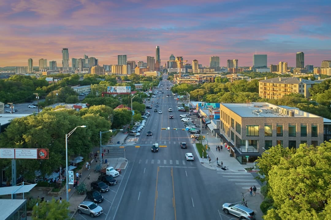 a city street with cars and buildings — Photo by Justin Wallace on Unsplash