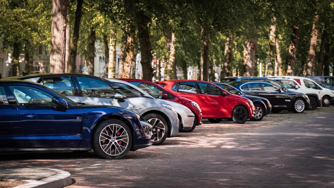blue and red sports car on road during daytime — Photo by Michael Fousert on Unsplash