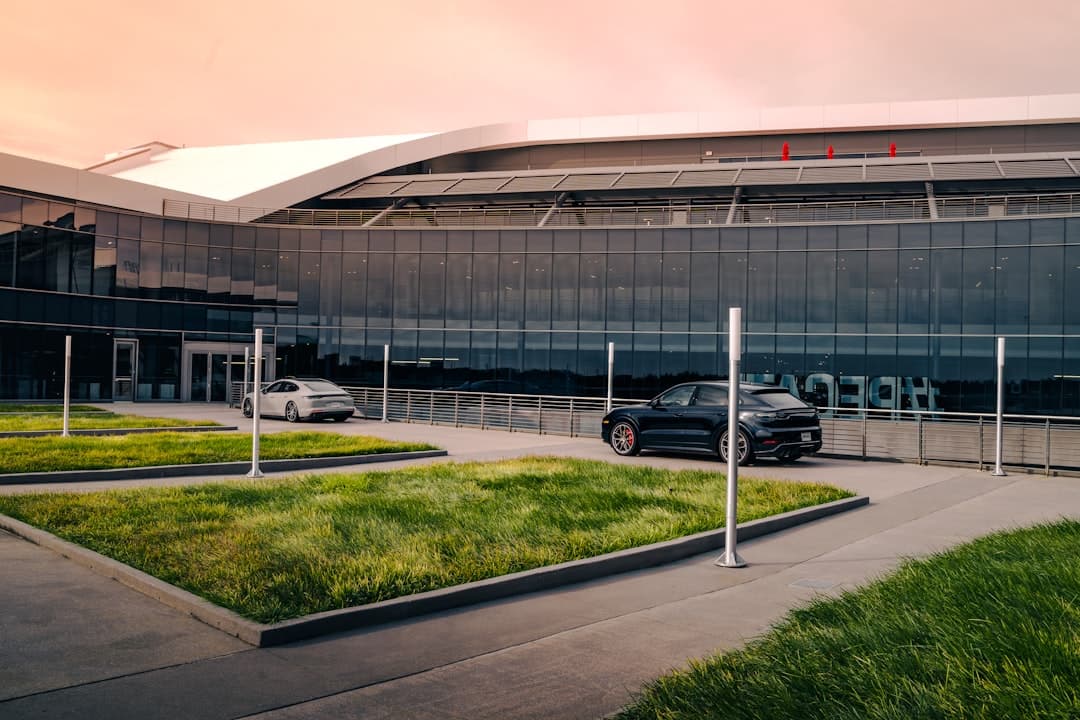 a black car parked in front of a large building — Photo by Jaime Castrillon on Unsplash
