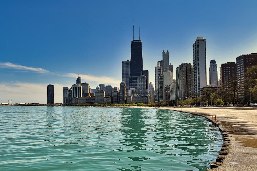 a body of water with a city in the background — Photo by Gijs Jakobs on Unsplash