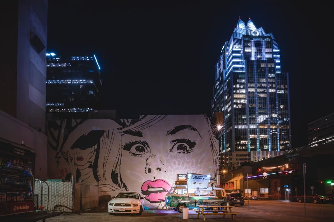 building with woman artwork — Photo by Cosmic Timetraveler on Unsplash