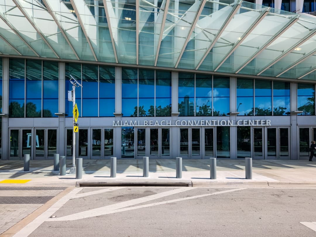 An empty parking lot in front of a building — Photo by Zoshua Colah on Unsplash