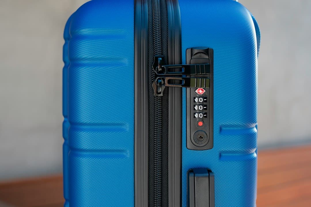 a blue piece of luggage sitting on top of a wooden table — Photo by American Green Travel on Unsplash