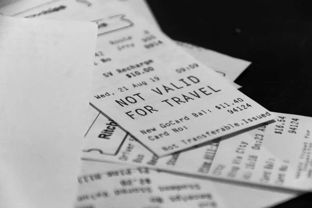 Pile of receipts, one says not valid for travel — Photo by Duskfall Crew on Unsplash