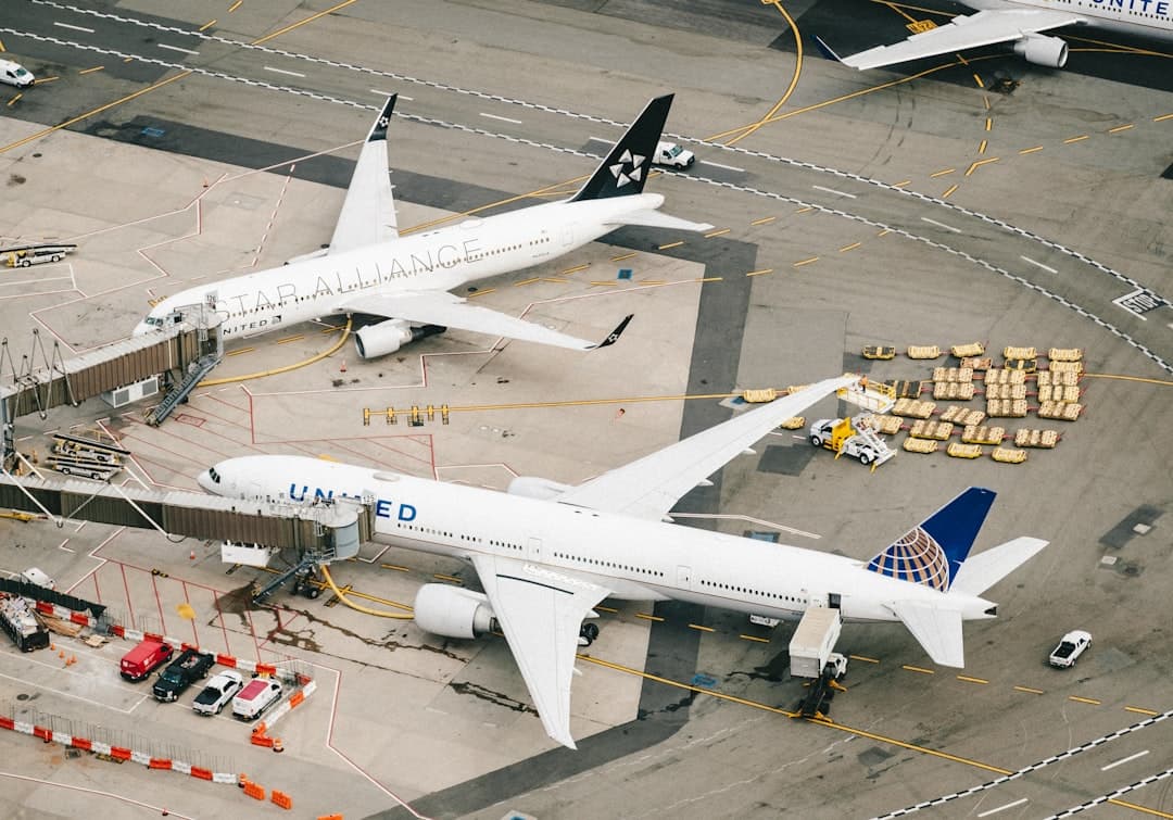 white and red airplane on airport during daytime — Photo by Chris Leipelt on Unsplash