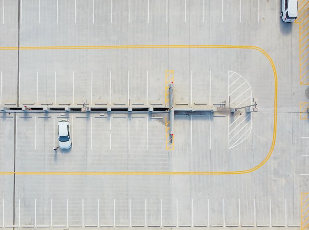 aerial view of white and yellow boat on dock during daytime — Photo by Lesia on Unsplash