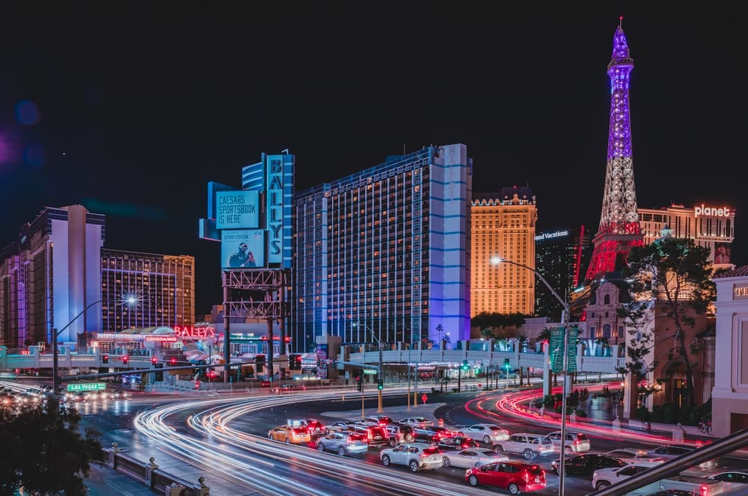 a city street filled with lots of traffic at night — Photo by Paul C Barranco on Unsplash