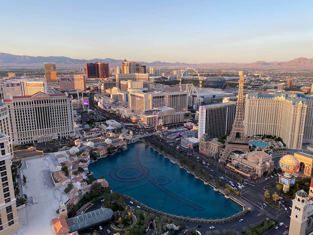 a view of a city with a lake in the middle of it — Photo by Christina on Unsplash