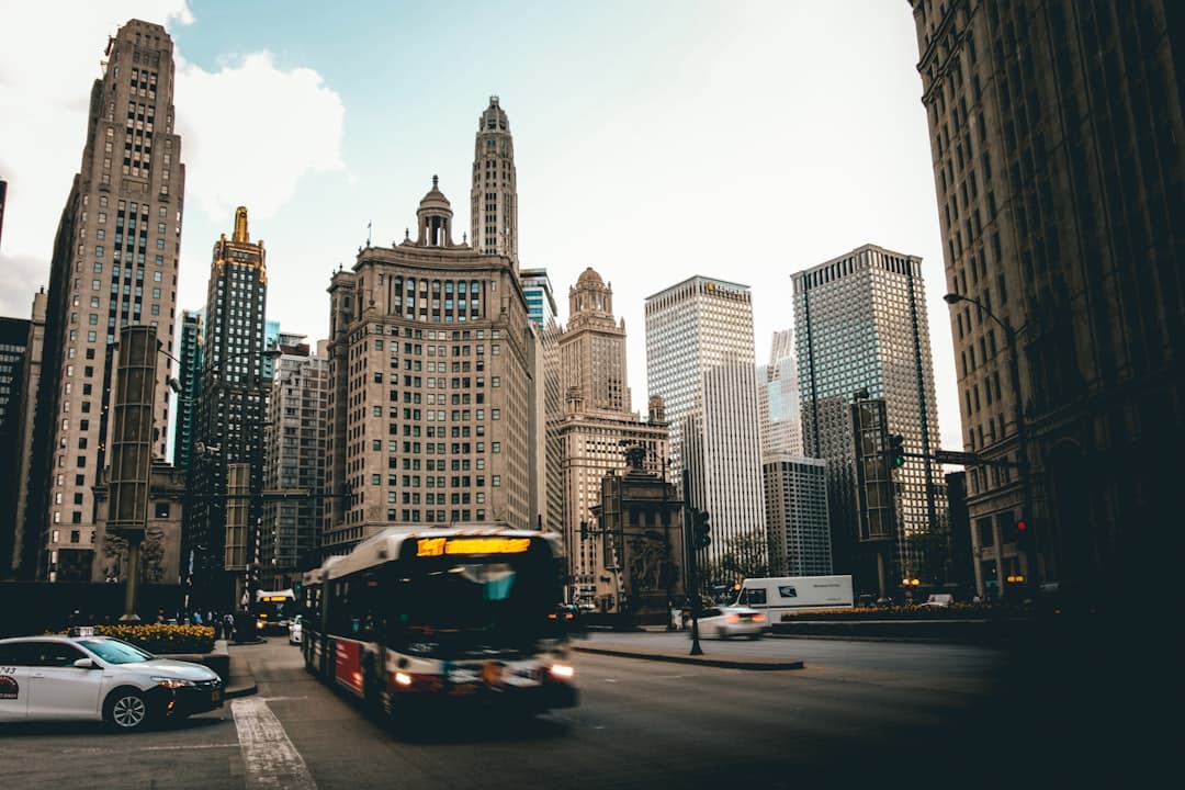 white and black bus on road — Photo by Sawyer Bengtson on Unsplash