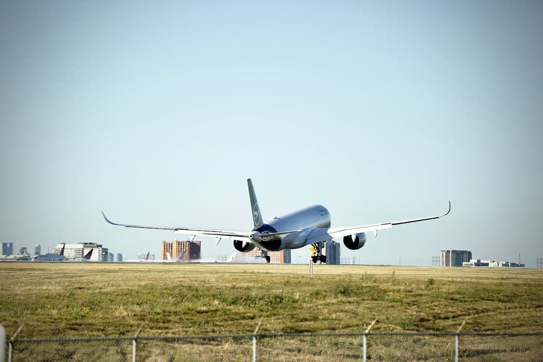 a large jetliner taking off from an airport runway — Photo by Michael on Unsplash