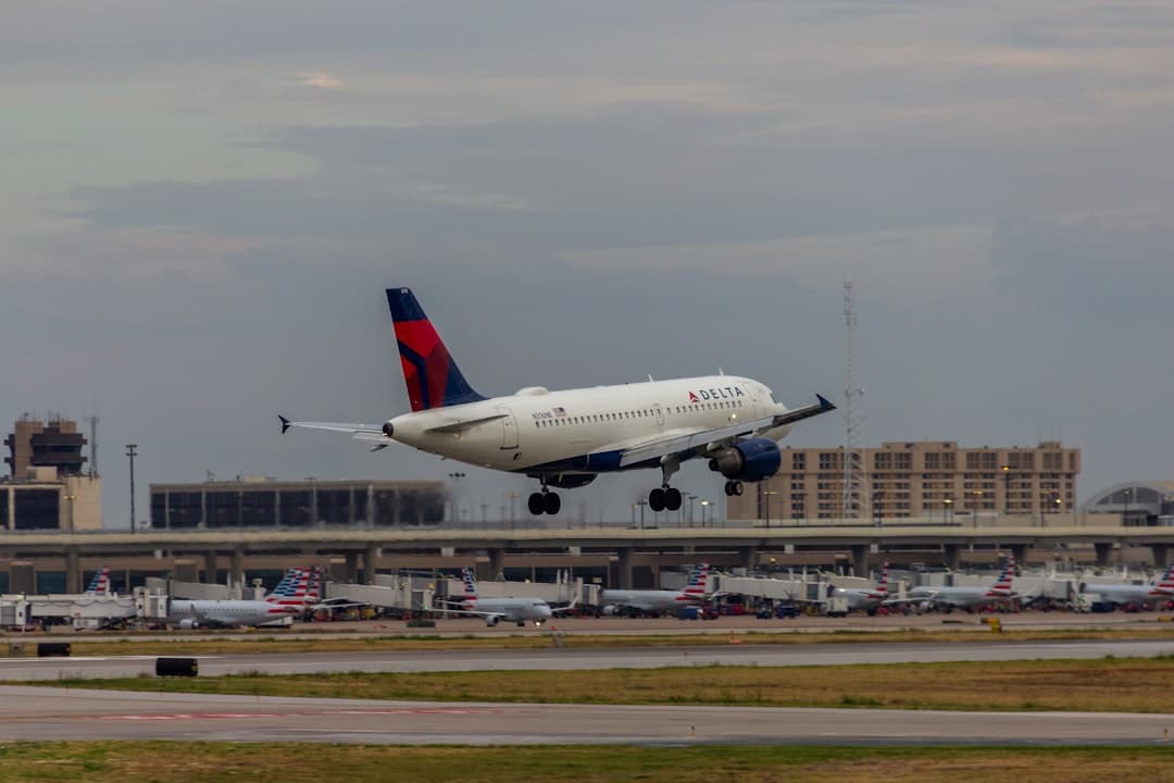 A large jetliner taking off from an airport runway — Photo by Izyan Sultanali on Unsplash