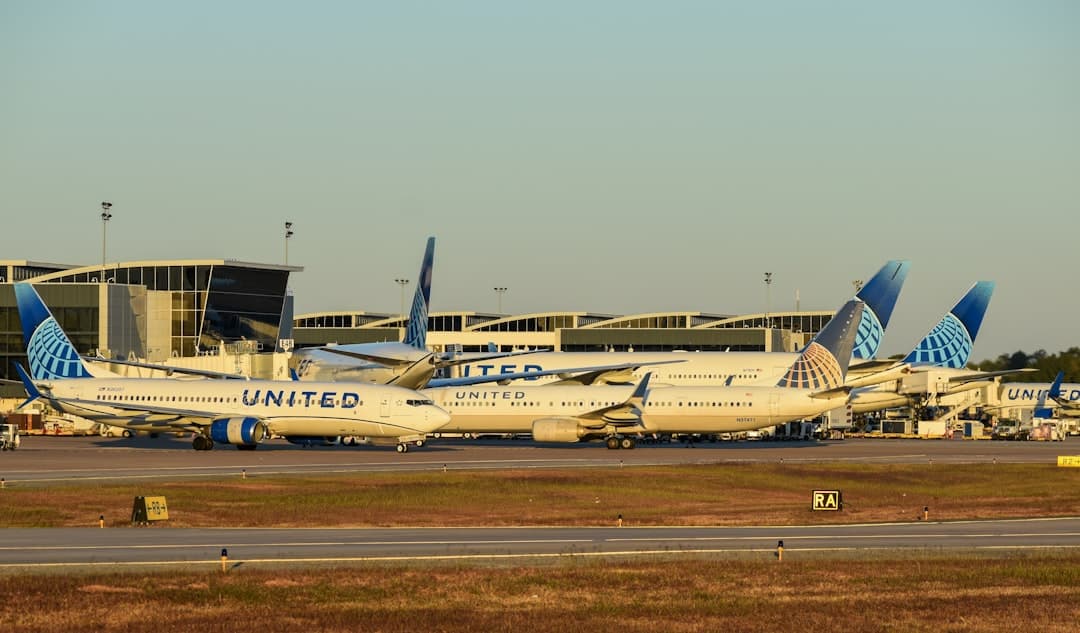 A bunch of airplanes that are on a runway — Photo by David Syphers on Unsplash