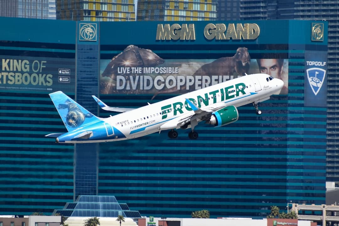 A large passenger jet flying over the las vegas strip — Photo by David Syphers on Unsplash
