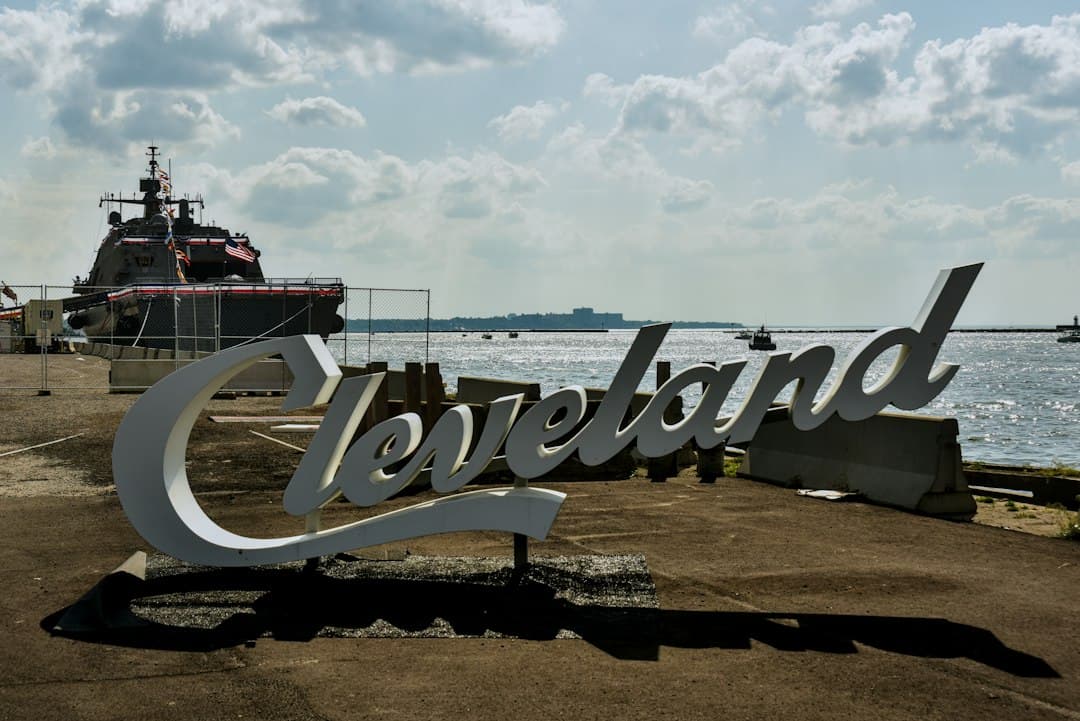 Cleveland sign overlooking the water with a ship — Photo by Chris Bischoff on Unsplash