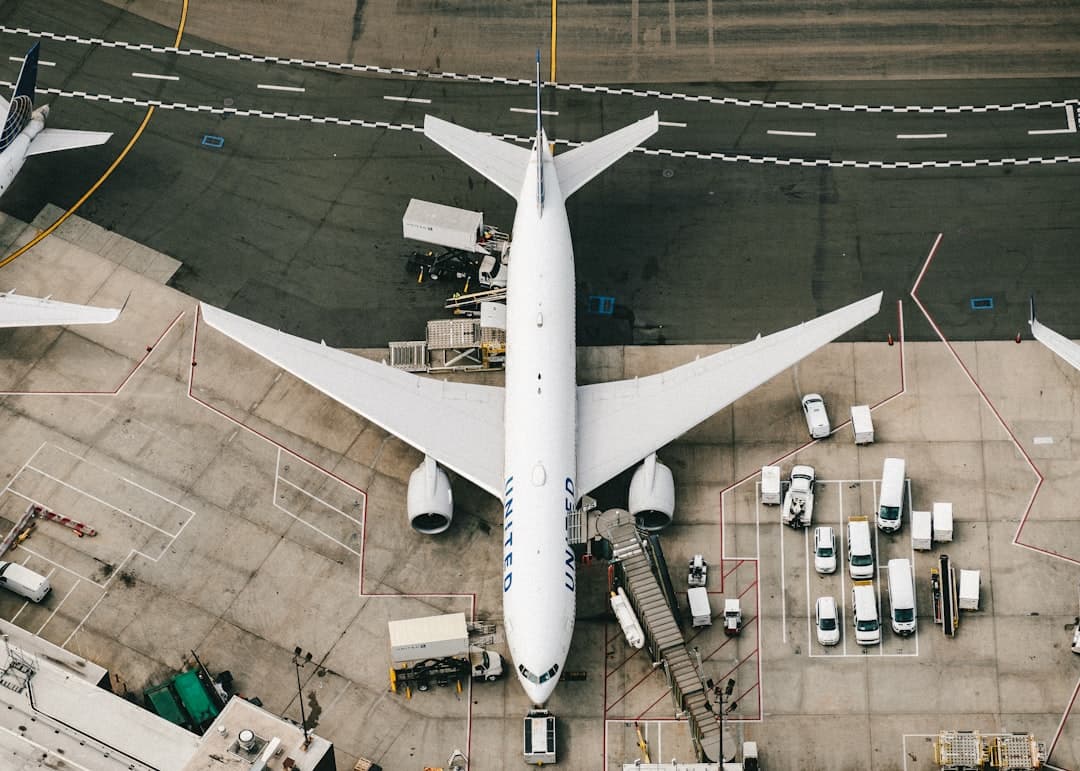 white and blue airplane on airport during daytime — Photo by Chris Leipelt on Unsplash