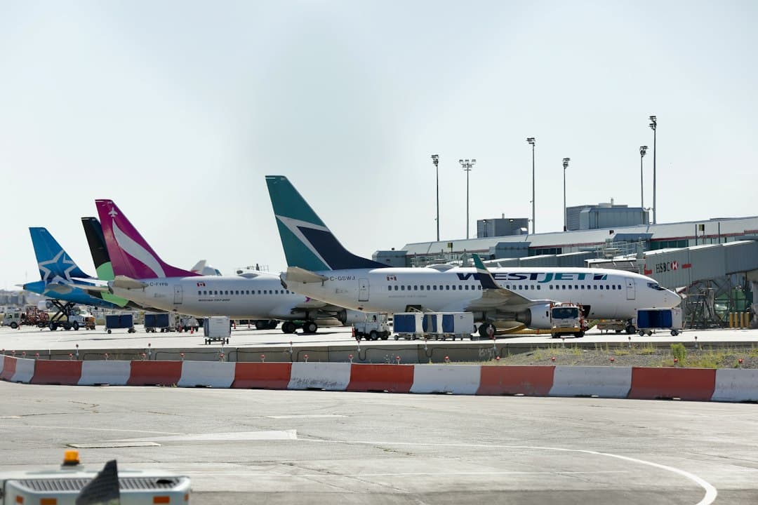 a couple of airplanes that are on a runway — Photo by Michael on Unsplash