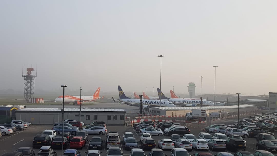vehicle parked in airport during daytime — Photo by Elizabeth Jamieson on Unsplash