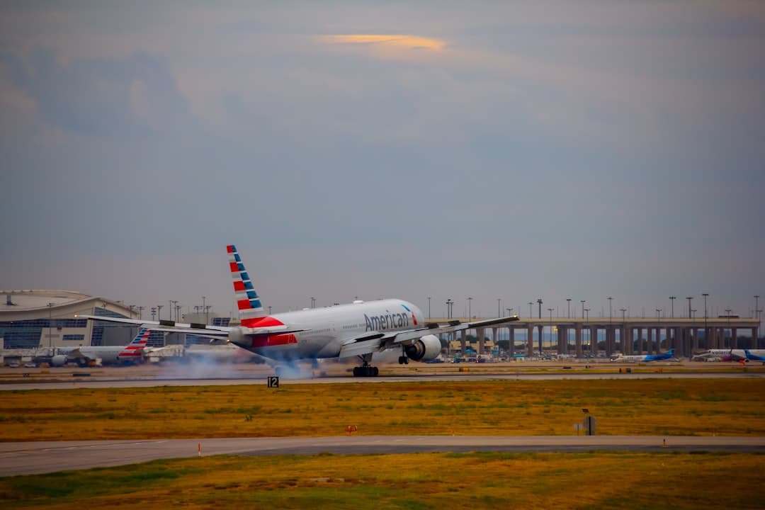 A large jetliner sitting on top of an airport runway — Photo by Izyan Sultanali on Unsplash