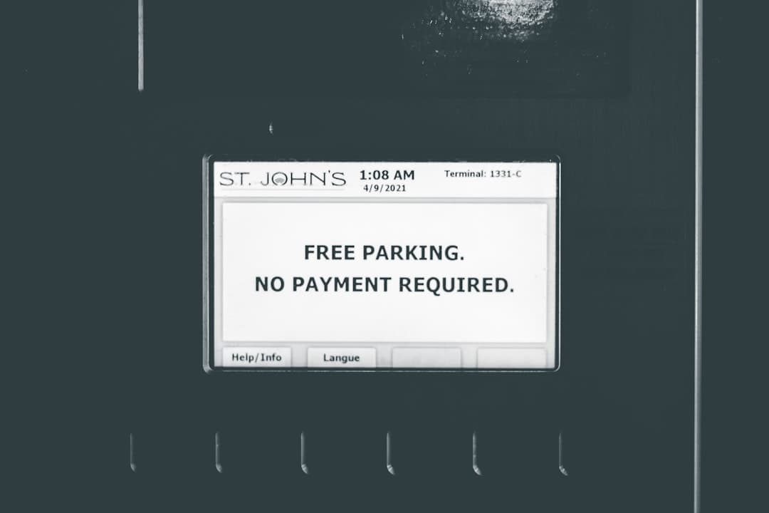 a black and white photo of a parking sign — Photo by Erik Mclean on Unsplash
