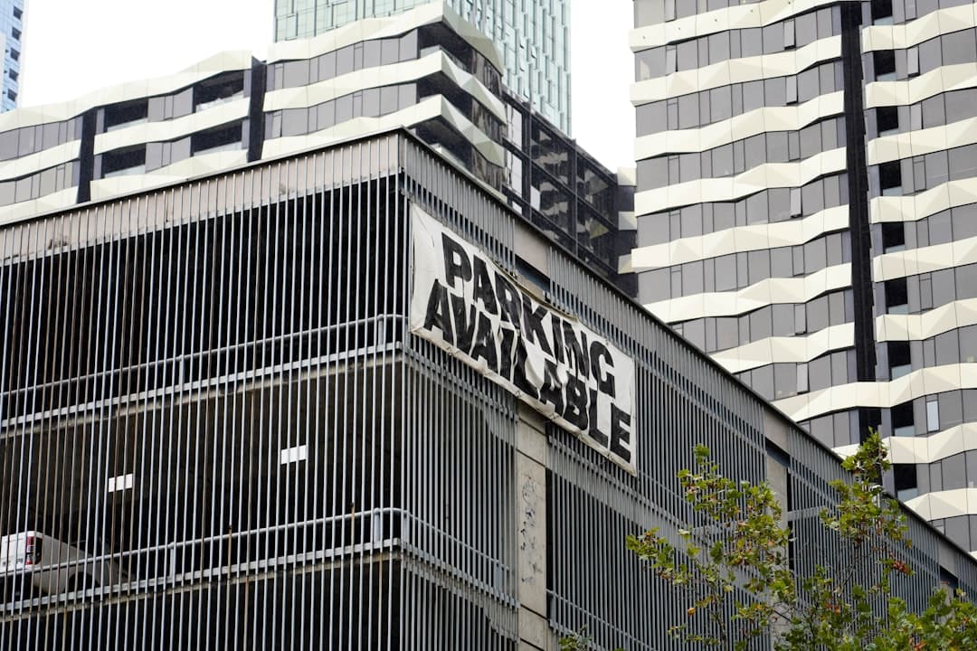 a street sign in front of a building — Photo by 0xk on Unsplash