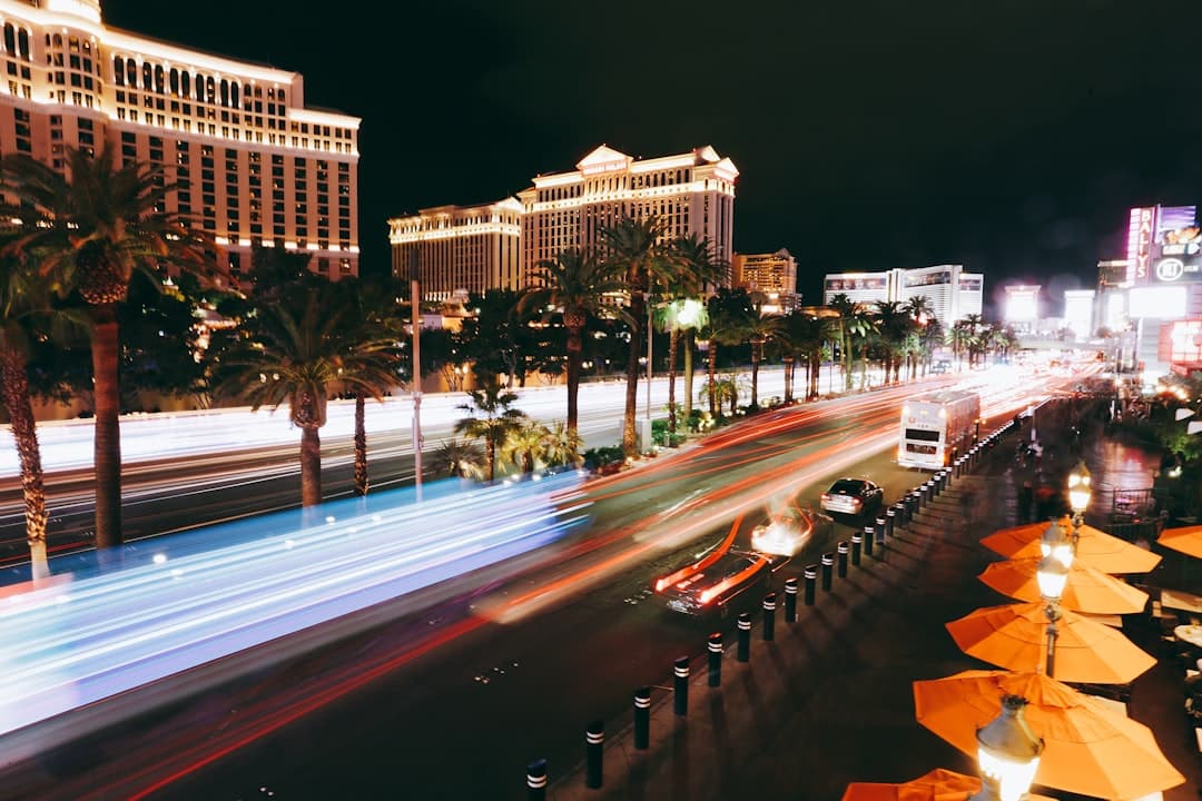 cars on road near high rise building during night time — Photo by Antonio Janeski on Unsplash