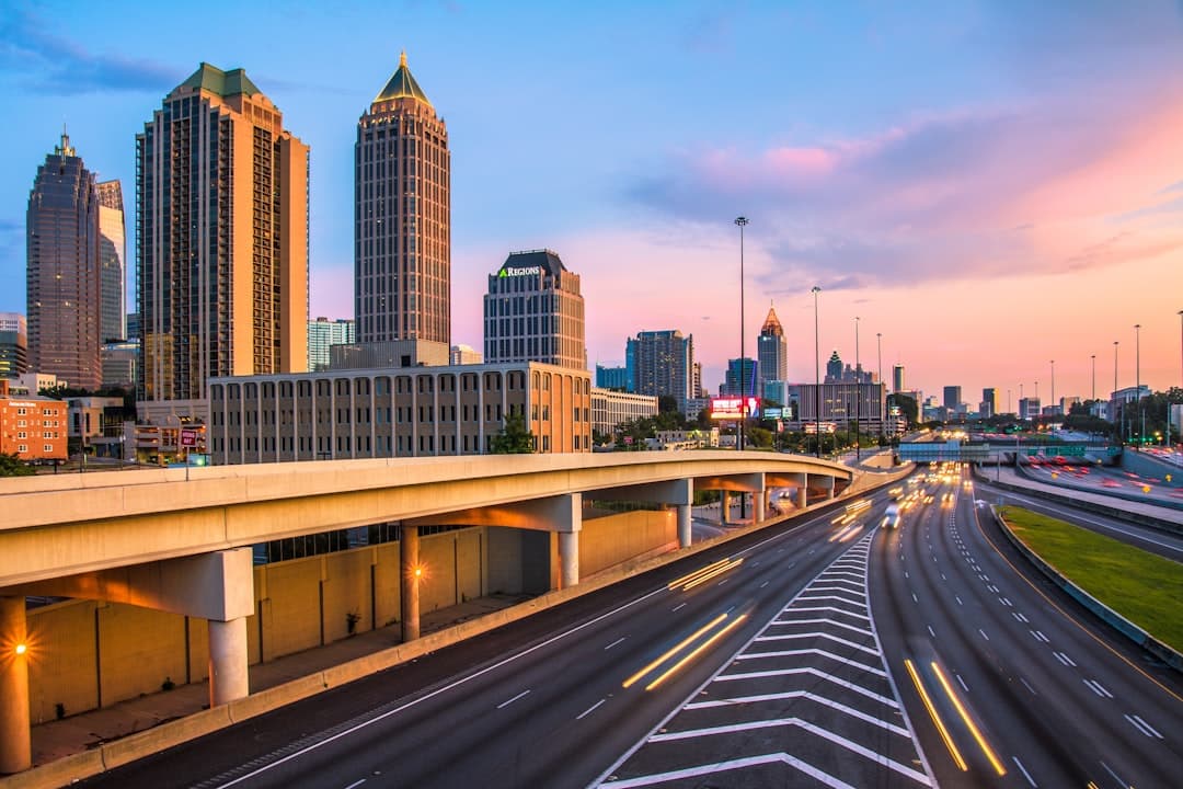 a city skyline at sunset — Photo by Nikolay Loubet on Unsplash